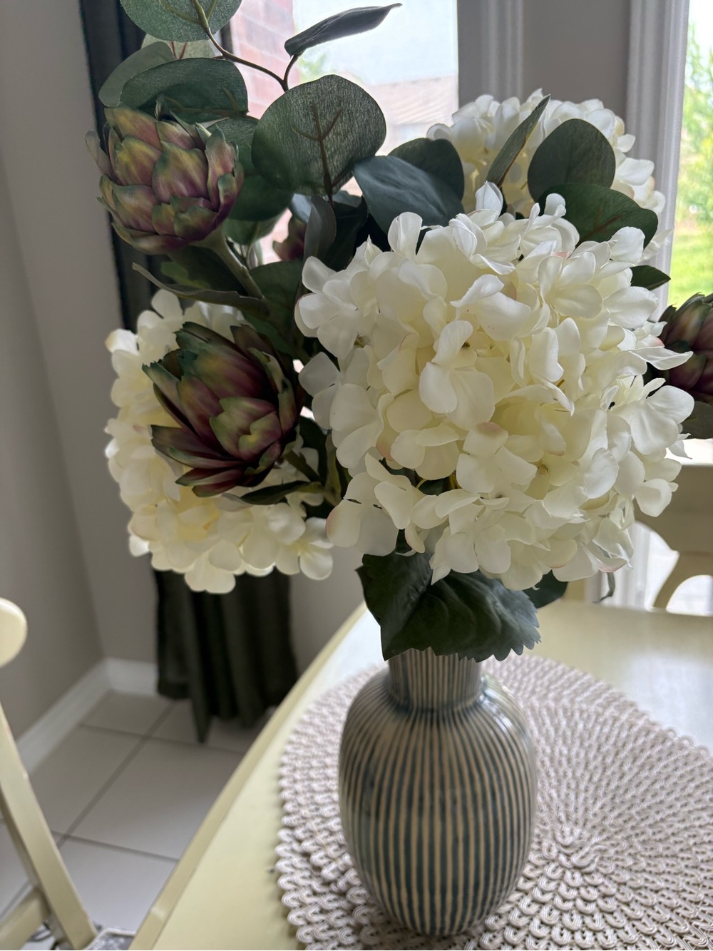 Cream Hydrangea Artichoke Floral Arrangement in Striped Ceramic Vase